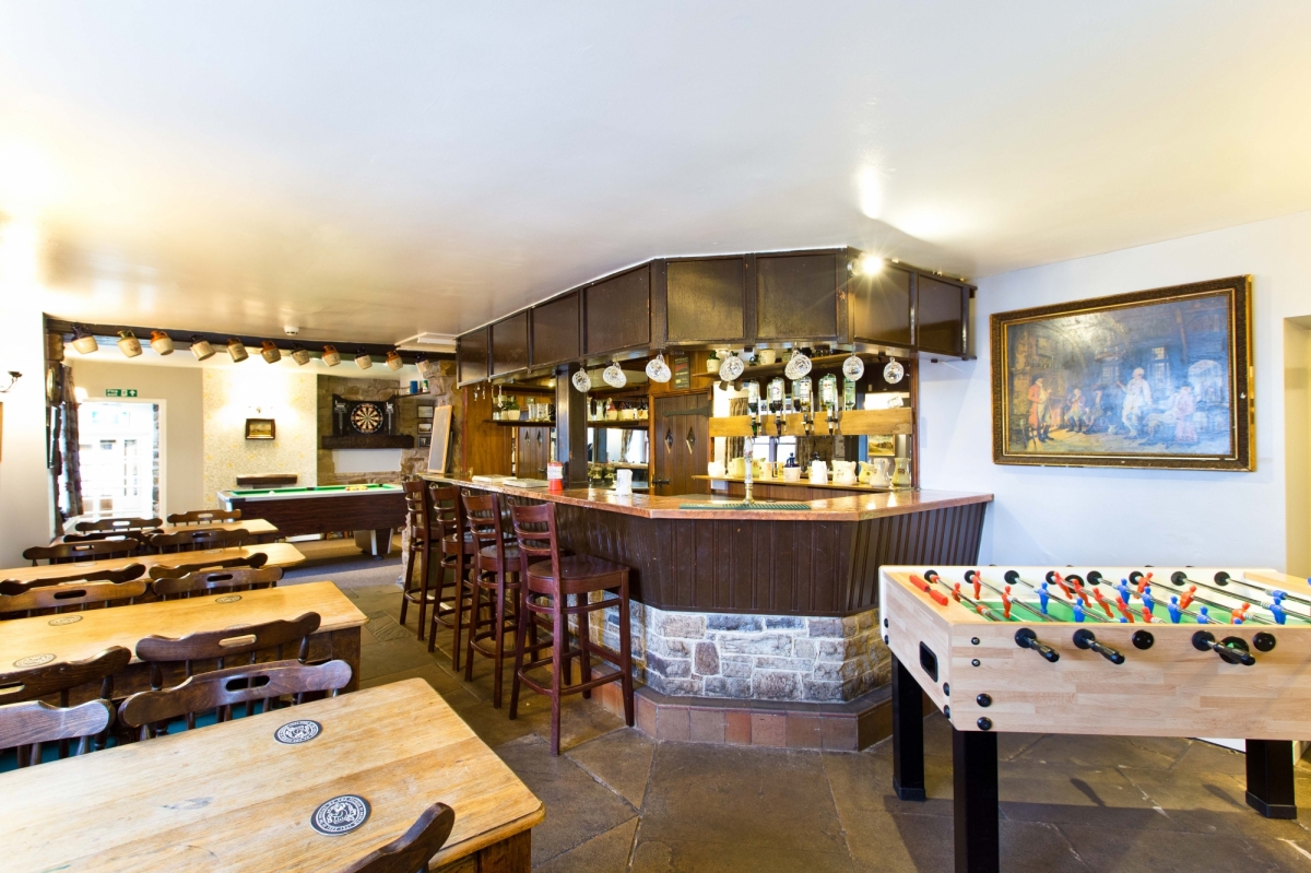 Bar with pool, table footy, darts, and karaoke!