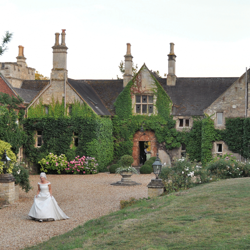 Bride walks from the Manor House to the marquee