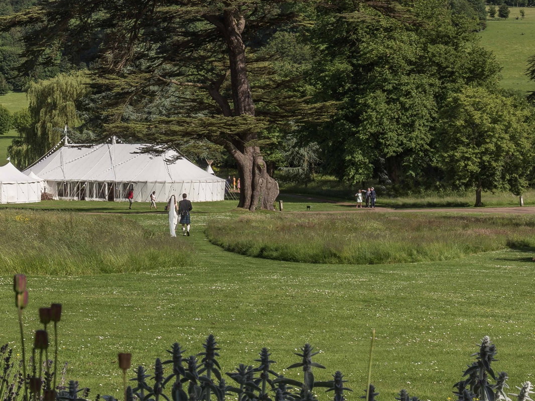 Couple walking to marquee. Image credit: Steve Tattersall