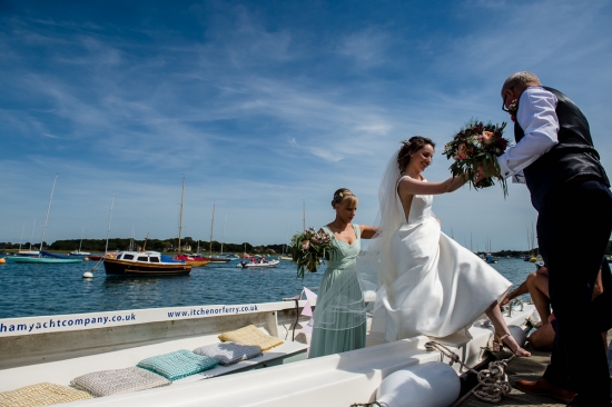 A bride arrives by boat