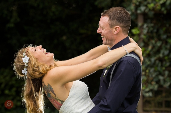 Laughing bride and groom at a Surrey wedding