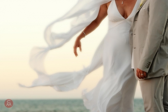 Bride's veil caught by the breeze on a Caribbean beach