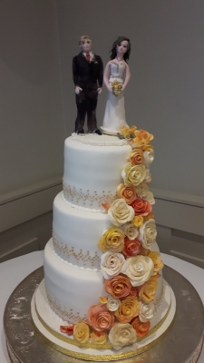 3 thier wedding cake with hand made bride and groom