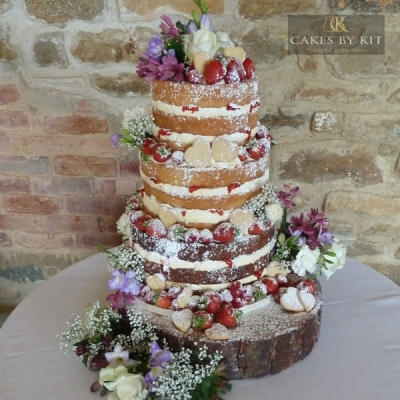 Naked Cake with berries, shortbread hearts and fresh flowers
